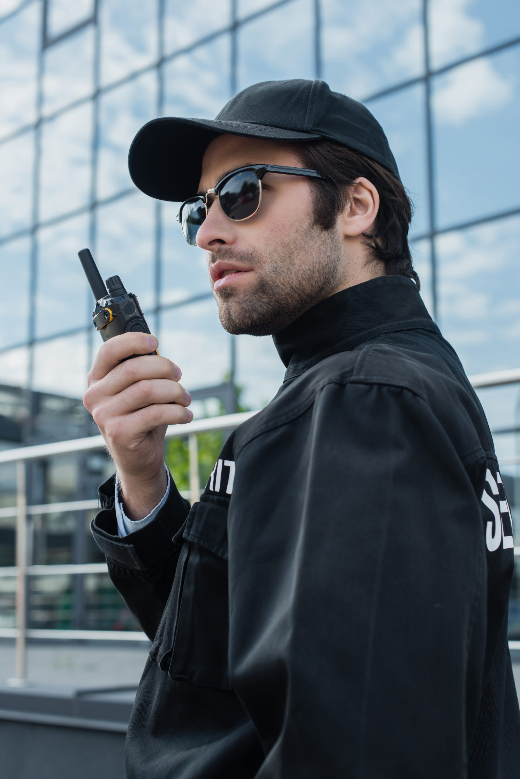 serious guard in sunglasses and black uniform talk 2024 11 08 14 32 33 utc scaled